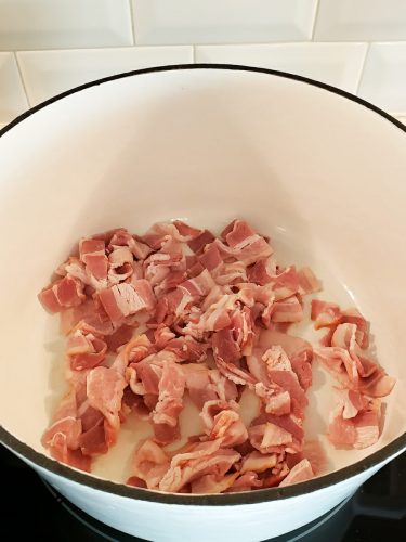 Bacon cooking in Dutch oven